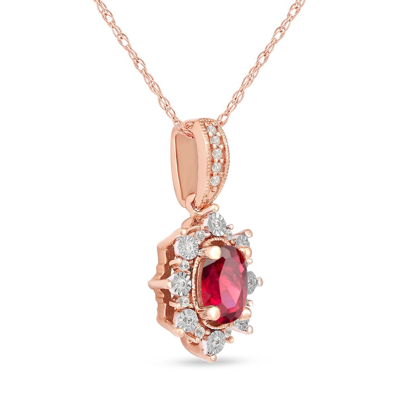 Oval Ruby and 0.07 CT. T.W. Natural Diamond Sunburst Frame Antique Vintage-Style Drop Pendant in 10K Rose Gold