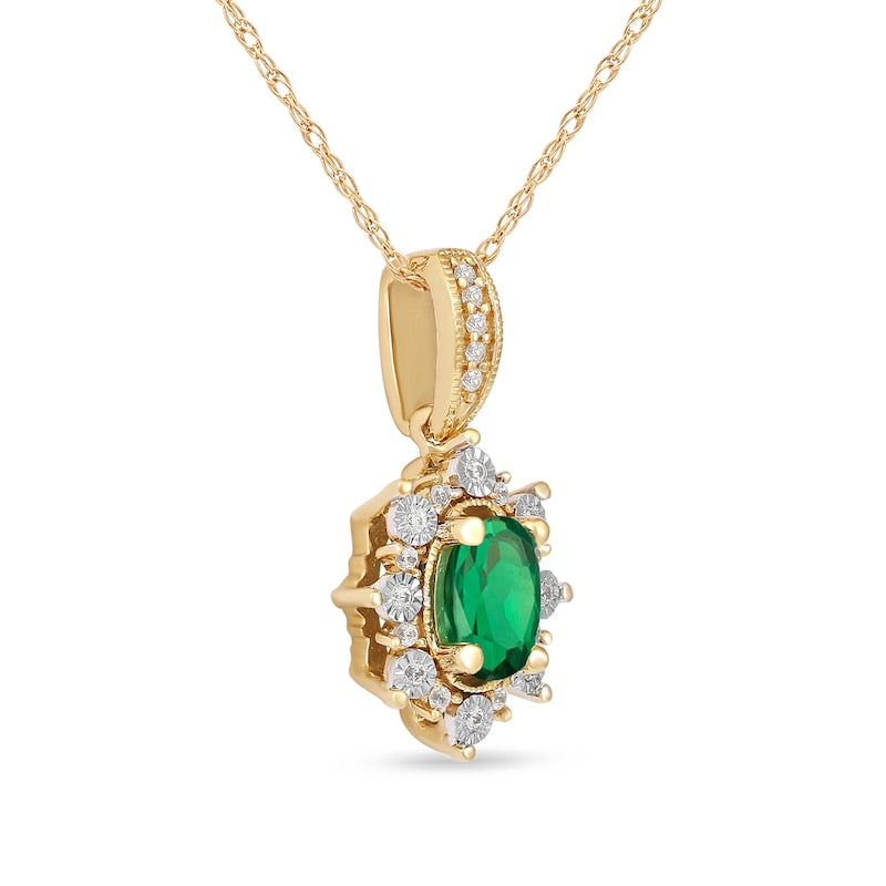 Oval Emerald and 0.07 CT. T.W. Natural Diamond Sunburst Frame Antique Vintage-Style Drop Pendant in 10K Yellow Gold