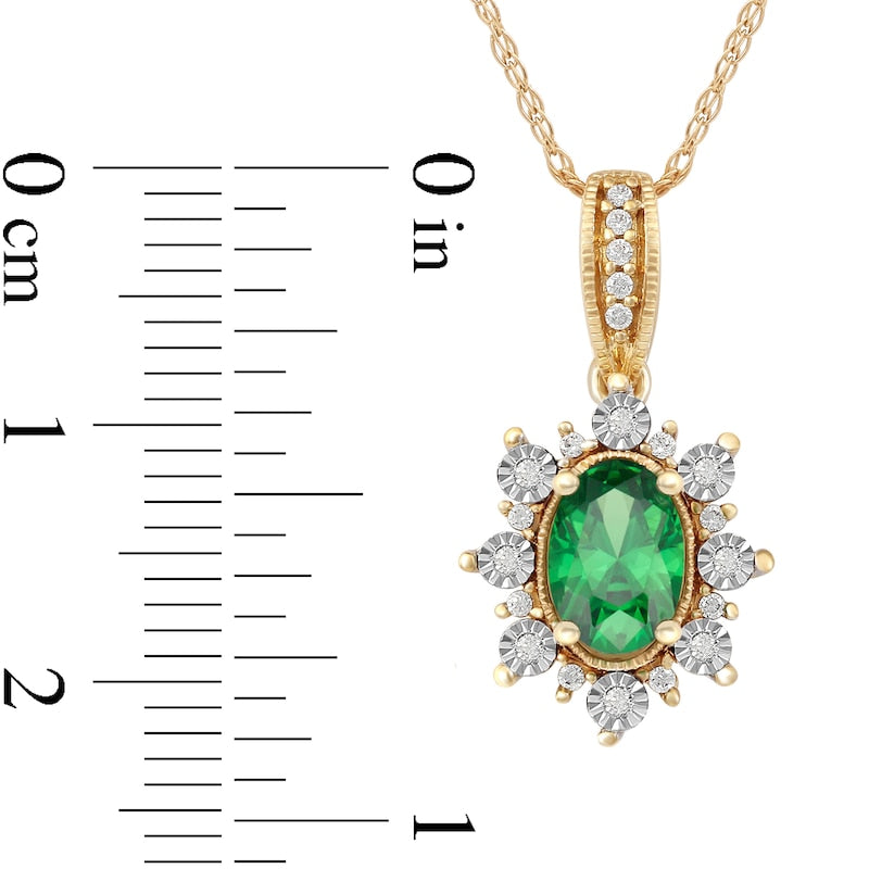 Oval Emerald and 0.07 CT. T.W. Natural Diamond Sunburst Frame Antique Vintage-Style Drop Pendant in 10K Yellow Gold