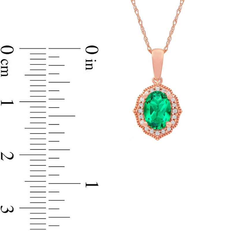 Oval Emerald and 0.05 CT. T.W. Natural Diamond Quatrefoil Frame Antique Vintage-Style Pendant in 10K Rose Gold