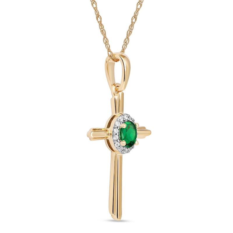 Oval Emerald and 0.05 CT. T.W. Natural Diamond Frame Layered Cross Pendant in 10K Yellow Gold