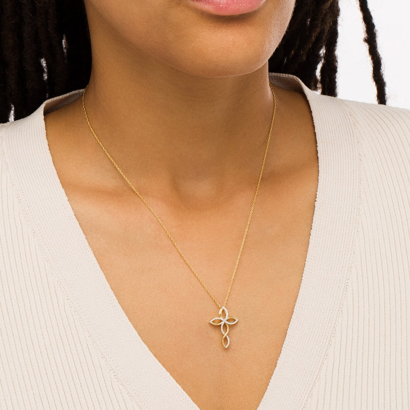 0.17 CT. T.W. Natural Diamond Twist Cross Pendant in 10K Yellow Gold