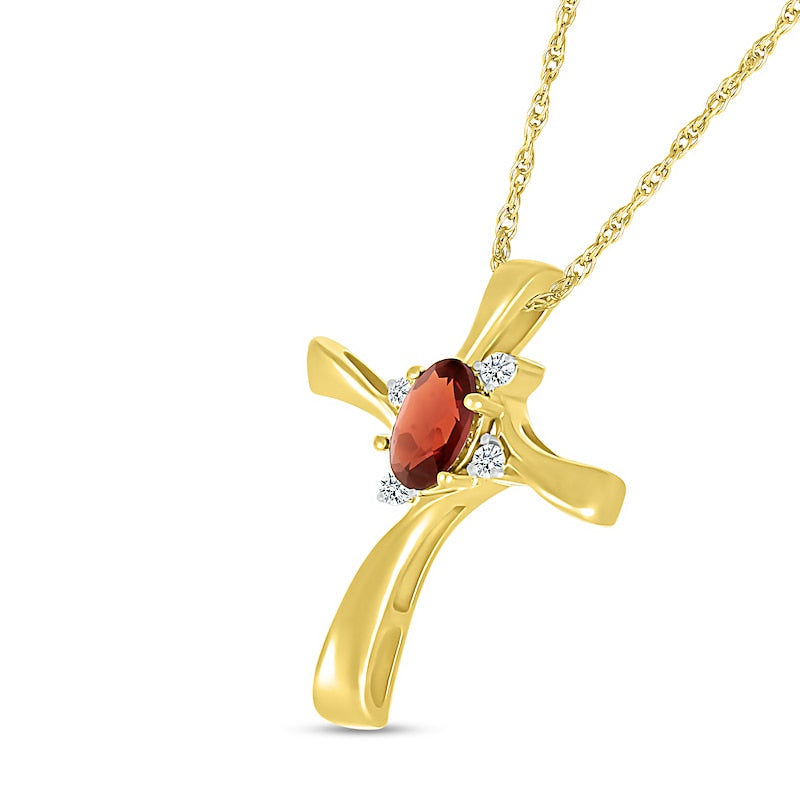 Oval Garnet and Natural Diamond Accent Swirl Ribbon Cross Pendant in 10K Yellow Gold