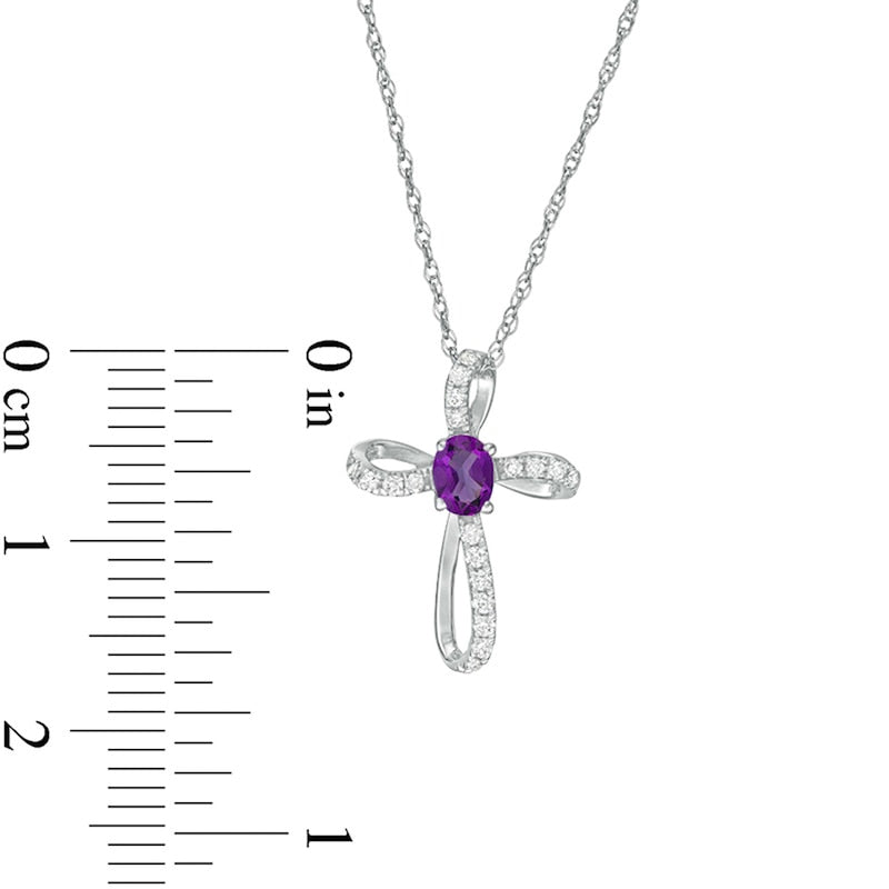 Oval Amethyst and 0.1 CT. T.W. Natural Diamond Pinwheel Cross Pendant in 10K White Gold