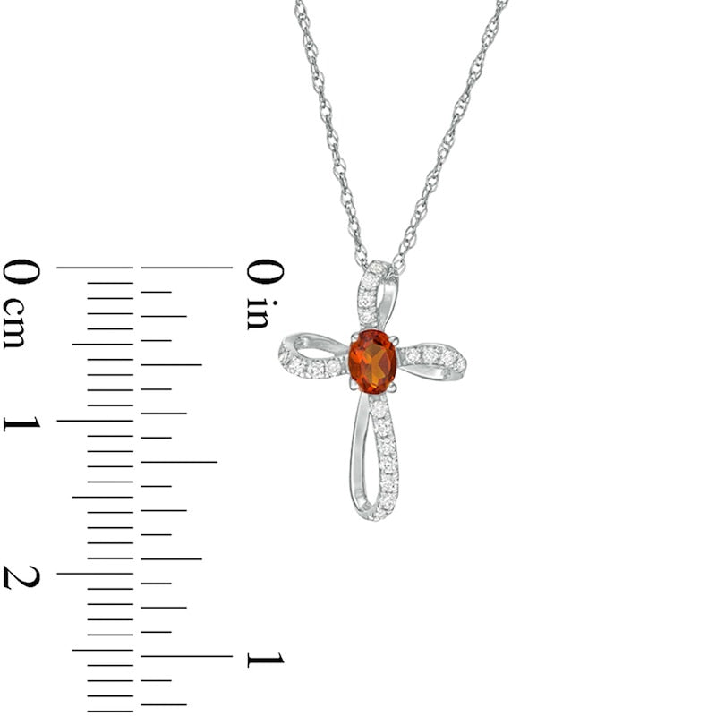 Oval Citrine and 0.1 CT. T.W. Natural Diamond Pinwheel Cross Pendant in 10K White Gold